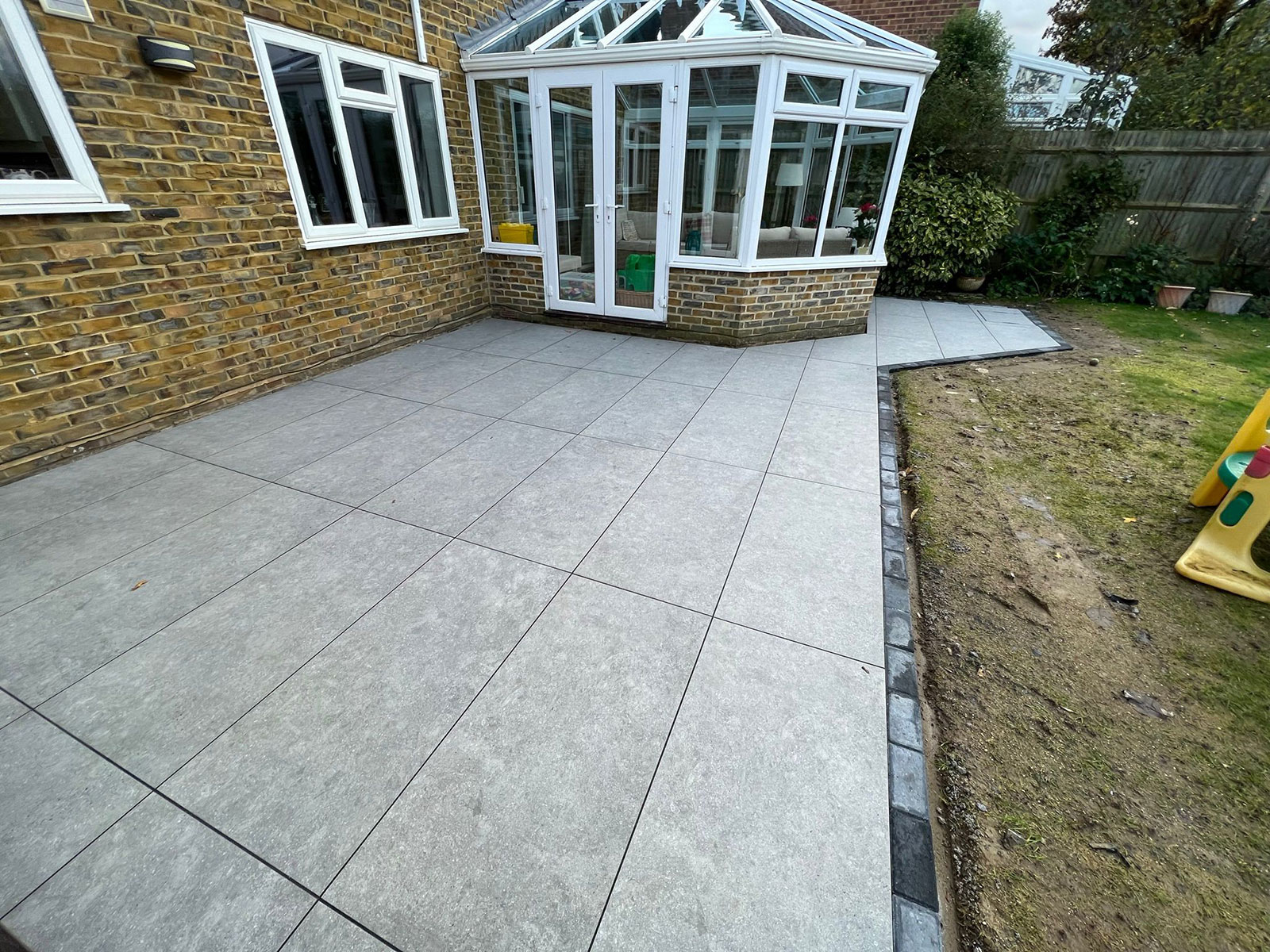 Porcelain patio by Stone Landscapes, Woking, Surrey